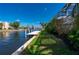 Waterfront home features a private dock with lush landscaping and canal access to provide boating enthusiasts easy access to the Gulf at 4431 Gardner Dr, Port Charlotte, FL 33952
