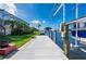 Modern boat dock and lift system next to a well-maintained lawn at 4431 Gardner Dr, Port Charlotte, FL 33952