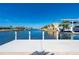 The property has a private concrete boat dock with lift providing direct access to the Gulf for boating and water activities at 4431 Gardner Dr, Port Charlotte, FL 33952