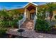 Inviting yellow home with lush landscaping, brick walkway, and grand entrance steps at 4431 Gardner Dr, Port Charlotte, FL 33952