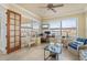 Home office with a desk, comfortable seating, and a door to the lanai at 4431 Gardner Dr, Port Charlotte, FL 33952