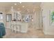 Spacious kitchen featuring white cabinets, granite counters, and a breakfast bar at 4431 Gardner Dr, Port Charlotte, FL 33952