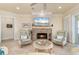 Living room with tile floors, stone fireplace, and elegant decor at 4431 Gardner Dr, Port Charlotte, FL 33952