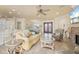 Open living room showcasing tile floors, sofa, and kitchen access at 4431 Gardner Dr, Port Charlotte, FL 33952