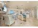 Spacious living room with tile floors, fireplace, and sliding doors to outdoor patio at 4431 Gardner Dr, Port Charlotte, FL 33952