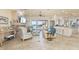 Spacious living room with tile floors, fireplace, and sliding doors to outdoor patio at 4431 Gardner Dr, Port Charlotte, FL 33952