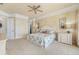 Spacious main bedroom with a ceiling fan and neutral colors, leading to a walk-in closet at 4431 Gardner Dr, Port Charlotte, FL 33952