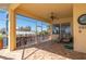 Enclosed patio with ceiling fan and lounge chairs overlooking a backyard boat dock and waterway at 4431 Gardner Dr, Port Charlotte, FL 33952