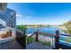 Backyard view of the water from wood porch, showcasing the canal access at 4431 Gardner Dr, Port Charlotte, FL 33952
