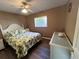 Bedroom with a queen bed, dresser, and laminate flooring at 4435 Inverness St, North Port, FL 34288