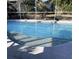 Inviting screened-in pool with concrete decking at 4435 Inverness St, North Port, FL 34288