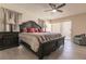 Spacious bedroom with king-size bed and ceiling fan at 69 Sabal Dr, Punta Gorda, FL 33950