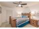King-size bedroom with wood furniture and ceiling fan at 69 Sabal Dr, Punta Gorda, FL 33950