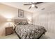 Bedroom with wicker furniture and ceiling fan at 69 Sabal Dr, Punta Gorda, FL 33950