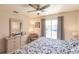 Bedroom with king bed, pool view, and ceiling fan at 69 Sabal Dr, Punta Gorda, FL 33950