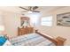 King-size bedroom with wood furniture and ceiling fan at 69 Sabal Dr, Punta Gorda, FL 33950