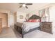 King-size bedroom with wood furniture and large windows at 69 Sabal Dr, Punta Gorda, FL 33950