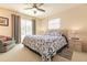 Bedroom with king bed, pool view, and ceiling fan at 69 Sabal Dr, Punta Gorda, FL 33950