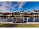Private boat dock on a calm canal with neighboring homes at 69 Sabal Dr, Punta Gorda, FL 33950