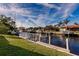 Scenic canal-front view with private dock and neighboring homes at 69 Sabal Dr, Punta Gorda, FL 33950