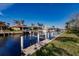Waterfront property with private boat dock and lush landscaping at 69 Sabal Dr, Punta Gorda, FL 33950