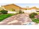 Single-story home with a circular driveway and mature landscaping at 69 Sabal Dr, Punta Gorda, FL 33950