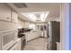 Modern kitchen with stainless steel appliances and light cabinets at 69 Sabal Dr, Punta Gorda, FL 33950