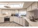 Modern kitchen with stainless steel appliances and light cabinets at 69 Sabal Dr, Punta Gorda, FL 33950