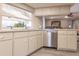 Modern kitchen with stainless steel dishwasher and light cabinets at 69 Sabal Dr, Punta Gorda, FL 33950