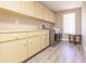 Laundry room with washer, dryer, cabinets, and a sink at 69 Sabal Dr, Punta Gorda, FL 33950