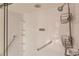 Walk-in shower with grab bars and multiple shelves at 69 Sabal Dr, Punta Gorda, FL 33950