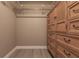 Large walk-in closet with built-in shelving and dresser at 69 Sabal Dr, Punta Gorda, FL 33950
