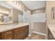 Double vanity bathroom with a large walk-in shower at 11137 Mcdermott Ct, Englewood, FL 34223