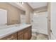 Clean bathroom, featuring a shower and vanity at 11137 Mcdermott Ct, Englewood, FL 34223
