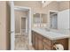 Bathroom boasts a vanity with dark brown cabinets at 11137 Mcdermott Ct, Englewood, FL 34223