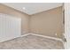 Empty bedroom with double door closet and tile floors at 11137 Mcdermott Ct, Englewood, FL 34223