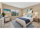 Spacious bedroom with large window and comfy seating at 11137 Mcdermott Ct, Englewood, FL 34223