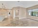 Open concept dining area with tile floors and neutral walls at 11137 Mcdermott Ct, Englewood, FL 34223