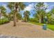 Relaxing dog park with shaded seating and waste disposal at 11137 Mcdermott Ct, Englewood, FL 34223