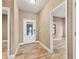 Bright and airy foyer with tile floors and neutral wall colors at 11137 Mcdermott Ct, Englewood, FL 34223