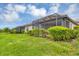 Home exterior showcasing a screened patio at 11137 Mcdermott Ct, Englewood, FL 34223