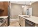 Modern kitchen with stainless steel appliances and an island at 11137 Mcdermott Ct, Englewood, FL 34223