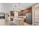 Modern kitchen with stainless steel appliances and an island at 11137 Mcdermott Ct, Englewood, FL 34223