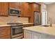 Modern kitchen with stainless steel appliances and an island at 11137 Mcdermott Ct, Englewood, FL 34223