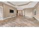 Open concept living room with views into the kitchen and access to a patio at 11137 Mcdermott Ct, Englewood, FL 34223