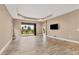 Spacious living room with tile floors, recessed lighting, and access to a patio at 11137 Mcdermott Ct, Englewood, FL 34223