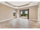 Spacious living room with tile floors, recessed lighting, and access to a patio at 11137 Mcdermott Ct, Englewood, FL 34223