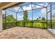 Spacious screened porch overlooking a garden at 11137 Mcdermott Ct, Englewood, FL 34223