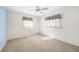 Cozy bedroom with light blue accent wall and ceiling fan at 157 Troutdale St, Port Charlotte, FL 33954