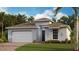 Single-story home with a two-car garage and attractive landscaping at 16098 Highgate St, Port Charlotte, FL 33953